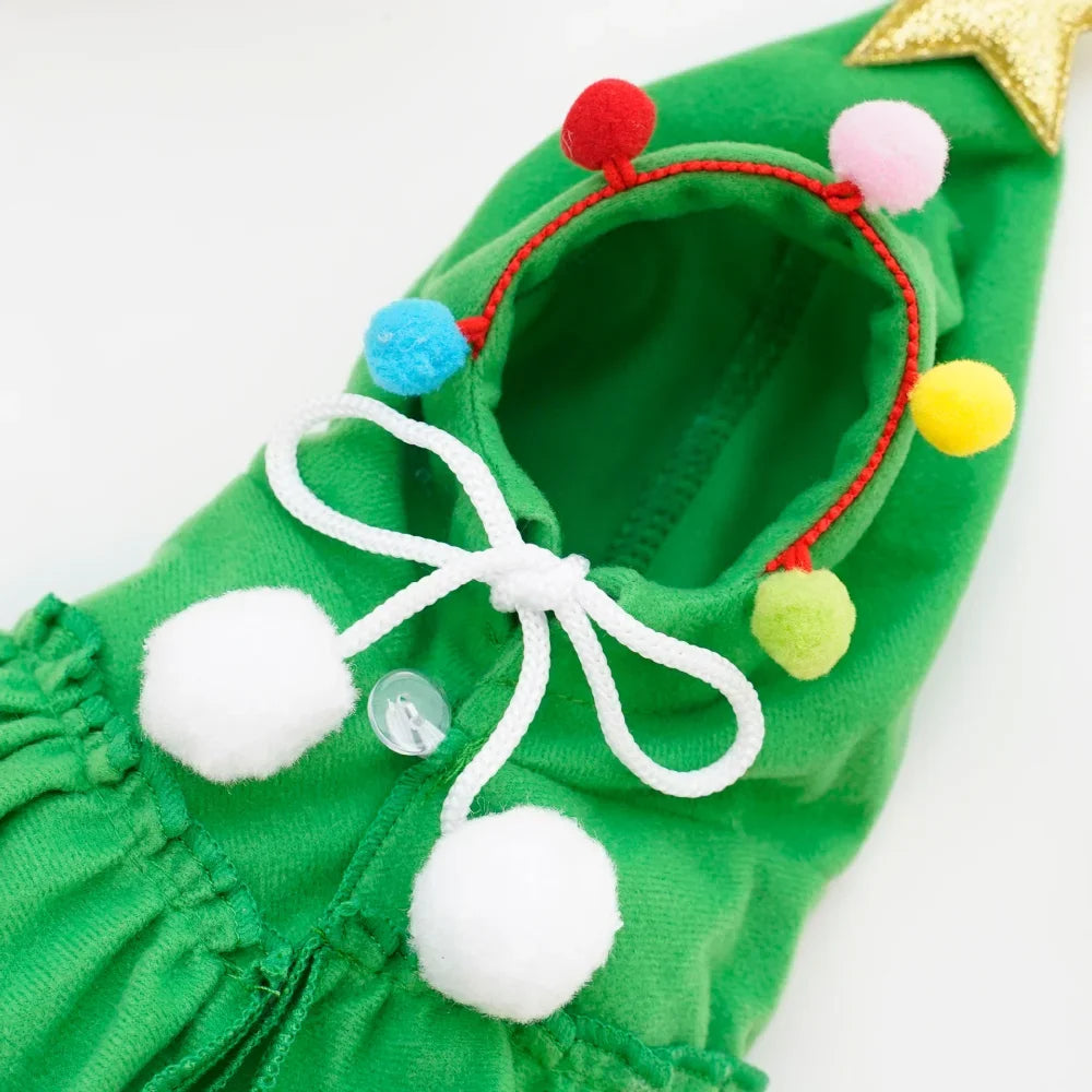 Close-up of the hood, pom-poms and bow tie